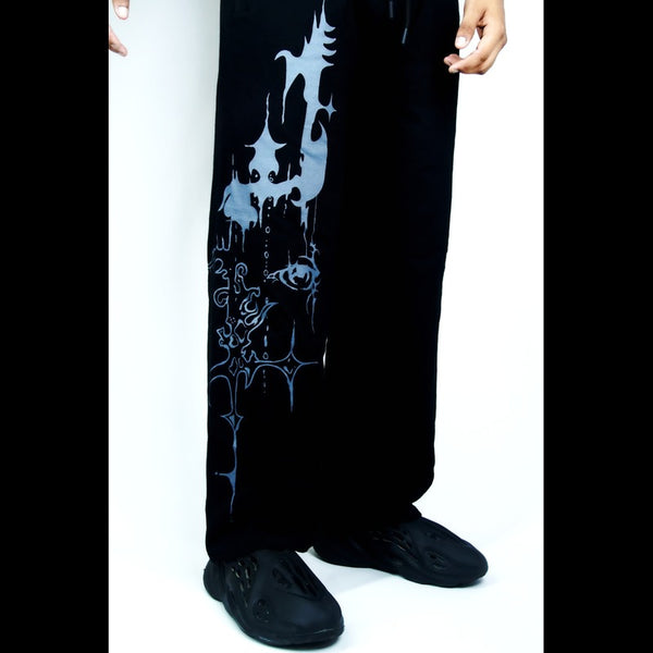 Black pants with a Grey graphic design on a white background